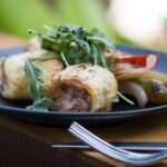 Stuffed chicken breast with sautéed greens